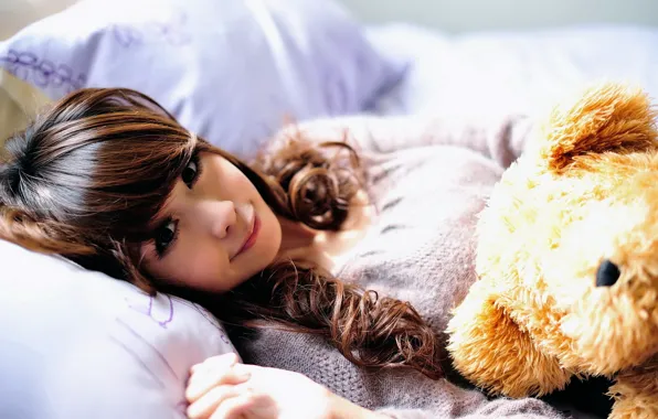 Picture girl, smile, toy, pillow, bear, bed, Asian, the sun's rays