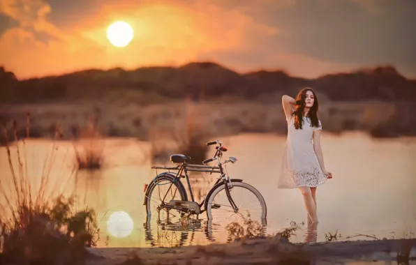 Picture girl, the sun, bike, in the water